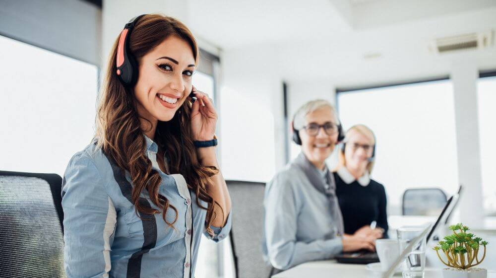 Female customer service agents taking calls in an after hours call center