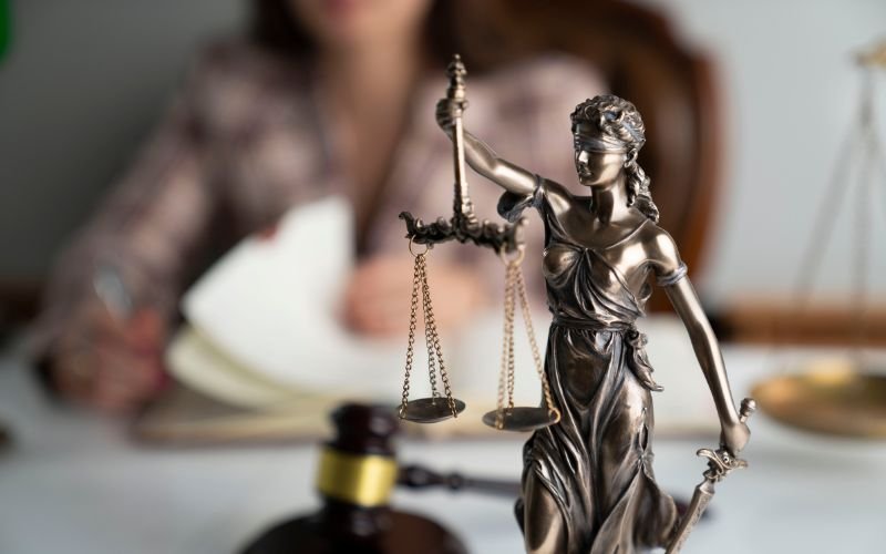 Scales of justice on attorney's desk