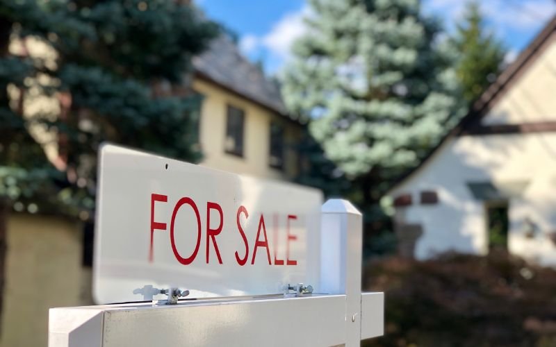 "For sale" sign in front of property