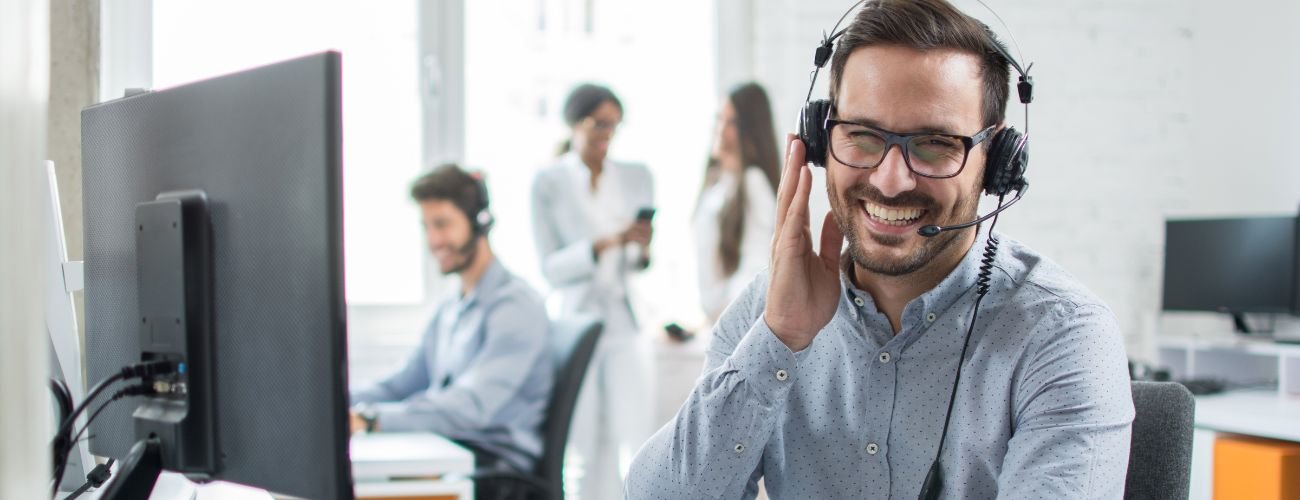 Smiling customer service agent in call center