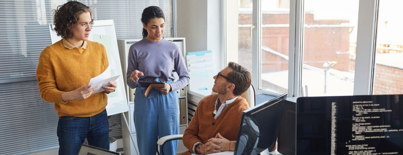 IT department collaborating in office